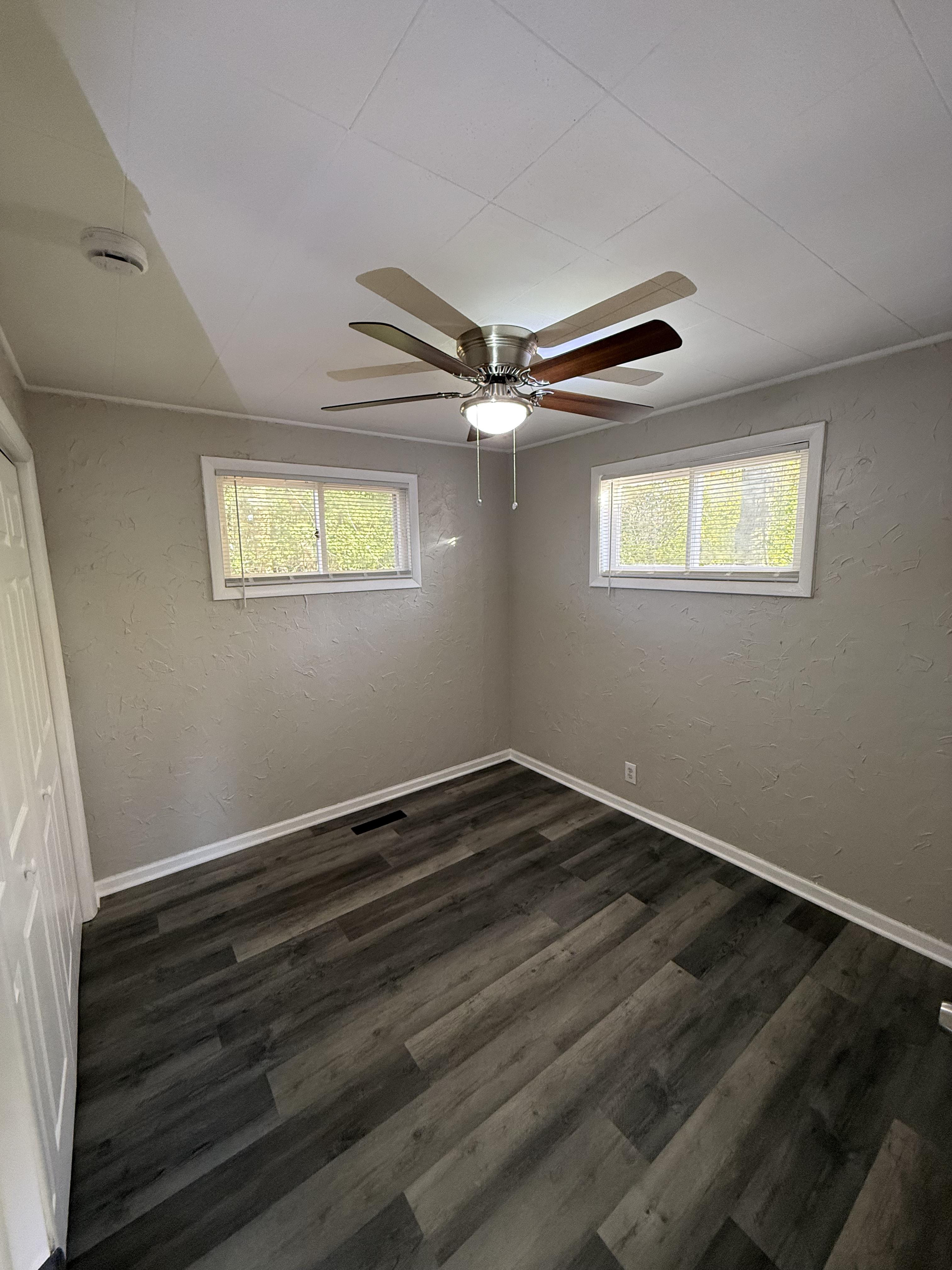 Finished bedroom renovation with premium paint and flooring